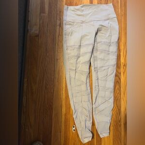 Lululemon gray women’s leggings with fun mesh cutouts